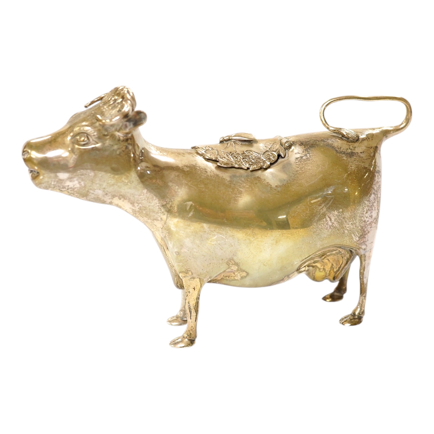 An Elizabeth II silver cow creamer, William Comyns & Sons Ltd, London, 1968, length 15cm, 14 grams. Condition - fair to good